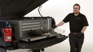 a man in front of an unassembled wheel bearing