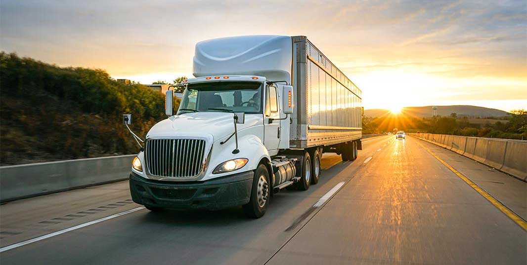 semi driving down a road