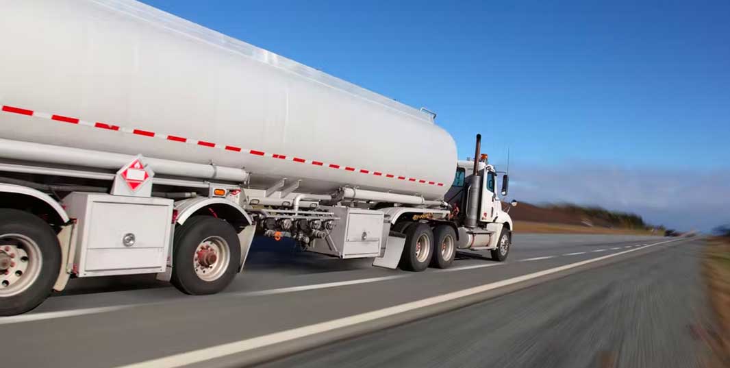 semi driving down a road